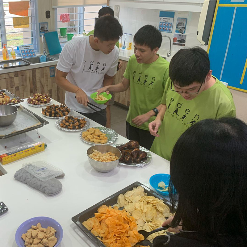 Adults on the spectrum learning how to prepare food at a Day Activity Centre 